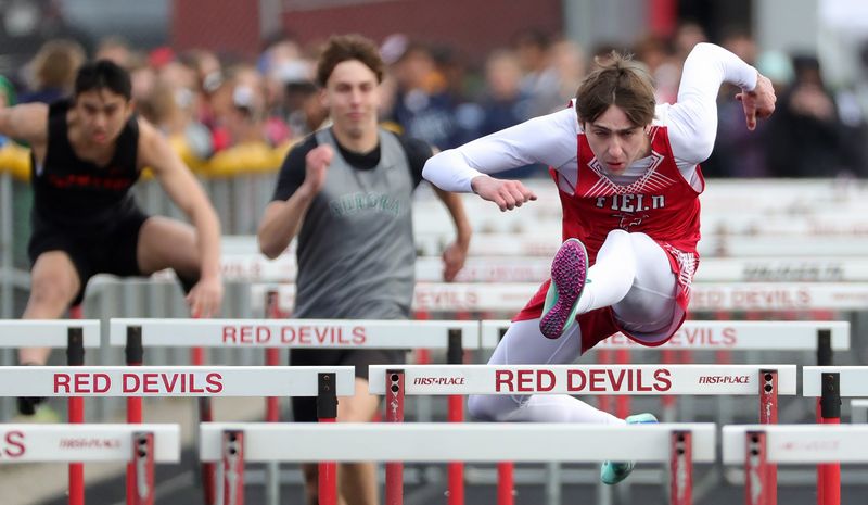 Field’s Logan Border, right, competes in the boys 110 meter hurdles event during the Don Faix Invitational track meet at Crestwood High School, April 11, 2026, in Mantua, Ohio.