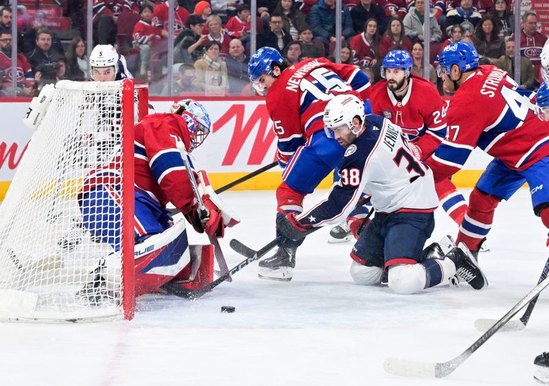 Apr 11, 2026; Montreal, Quebec, CAN; Montreal Canadiens goalie Jakub Dobes (75) stops Columbus Blue Jackets forward Boone Jenner (38) during the first period at the Bell Centre. Mandatory Credit: Eric Bolte-Imagn Images