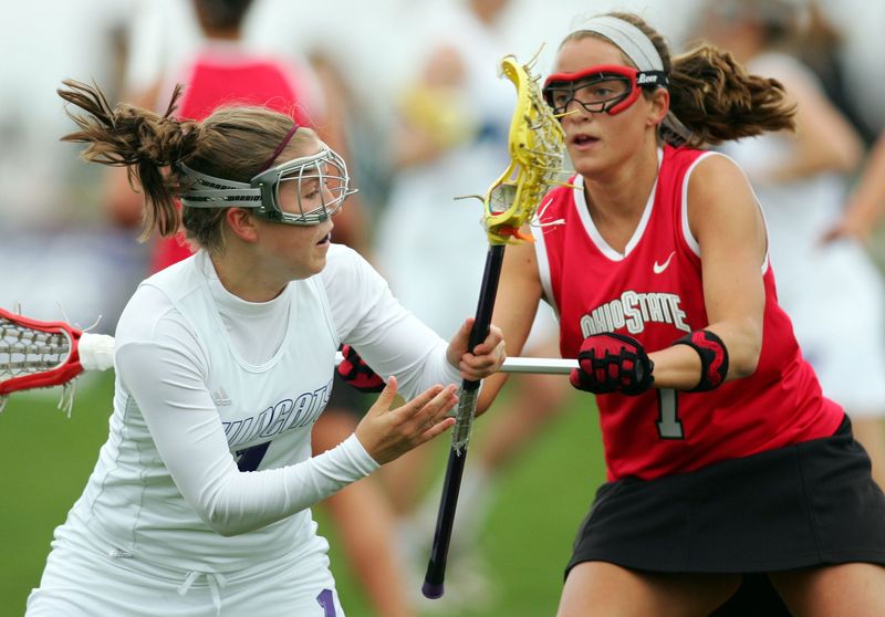 Apr 28, 2007; Evanston, IL, USA; Ohio State Buckeyes defenseman (7) Danielle Gibson defends against Northwestern Wildcats attackman (1) Hilary Bowen during the first half at the Thomas Athletic Complex in Evanston, IL. Northwestern beat Ohio State 22-5 to clinch the American Lacrosse Conference title. Mandatory Credit: Jerry Lai-USA TODAY Sports © Copyright 2007 Jerry Lai