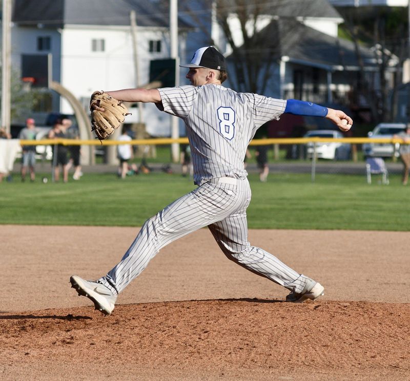 Cambridge's Garrett Carpenter (8) delivers a pitch during action with Barnesville on Monday, April 13, 2026. The Shamrocks rallied to collect their eighth straight victory by a final score of 15-5 to improve to 8-1 on the year.