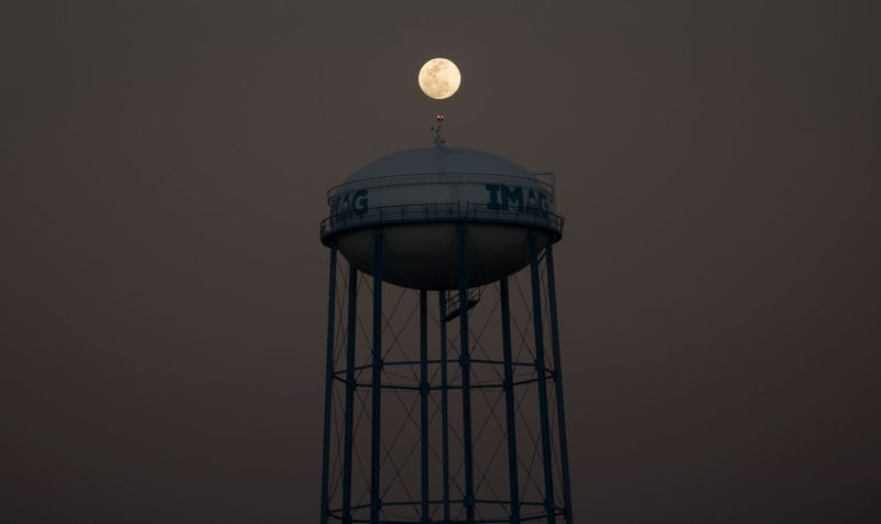 FILE PHOTO: The full moon rises over the water tower at the Imaginarium Science Center in Fort Myers on Monday 2/18/2019.