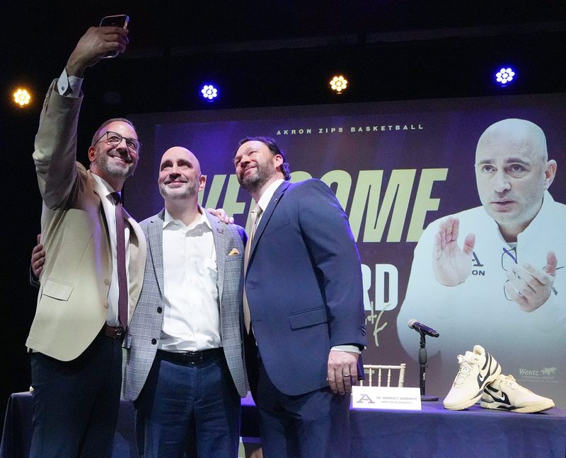 From left, University of Akron president R.J. Nemer, Zips men's basketball coach Dustin Ford and athletic director Andrew T. Goodrich take a selfie after the introduction of Ford as the new Zips coach on April 15, 2026, at House Three Thirty.