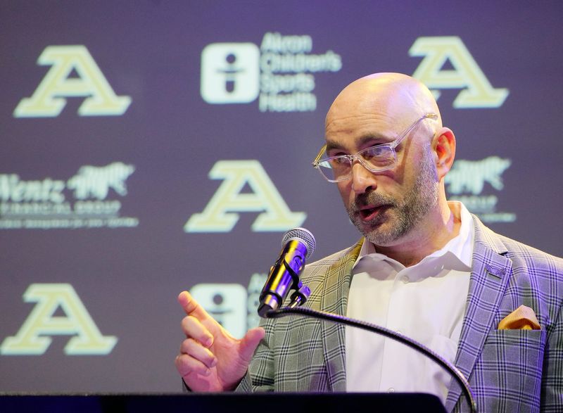 New men's basketball coach Dustin Ford is congratulated by UA president R.J. Nemer at the event to introduce coach Ford at House Three Thirty in Akron on April 15, 2026.