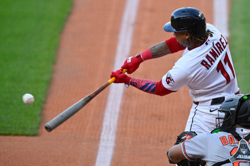 Guardians third baseman Jose Ramirez hits a two-run home run in the first inning against the Baltimore Orioles, April 16, 2026, in Cleveland.