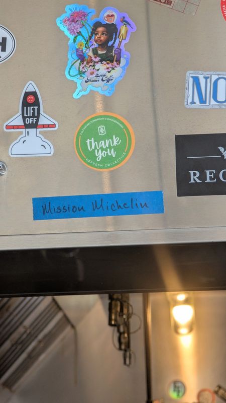 A piece of tape, reading "Mission Michelin," which chef Jeff Harris placed on his oven hood two years ago.