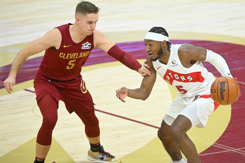 Jan 9, 2025; Cleveland, Ohio, USA; Cleveland Cavaliers guard Sam Merrill (5) defends Toronto Raptors guard Immanuel Quickley (5) in the fourth quarter at Rocket Mortgage FieldHouse. Mandatory Credit: David Richard-Imagn Images