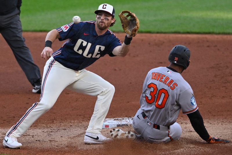 Apr 17, 2026; Cleveland, Ohio, USA; Baltimore Orioles center fielder Leody Taveras (30) steals second base beside Cleveland Guardians shortstop Daniel Schneemann (10) in the second inning at Progressive Field. Mandatory Credit: David Richard-Imagn Images