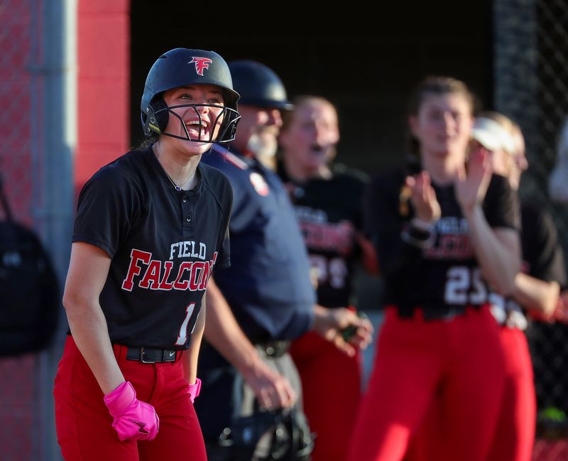 Field’s Aubrey Homan celebrates after scoring on a hit by Allison Barto during the seventh inning of a high school softball game at Field High School, April 17, 2026, in Mogadore, Ohio.