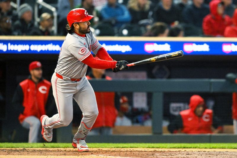 Reds third baseman Eugenio Suarez connects on his two-run double of Twins starter Joe Ryan in the fourth inning at Target Field April 17.