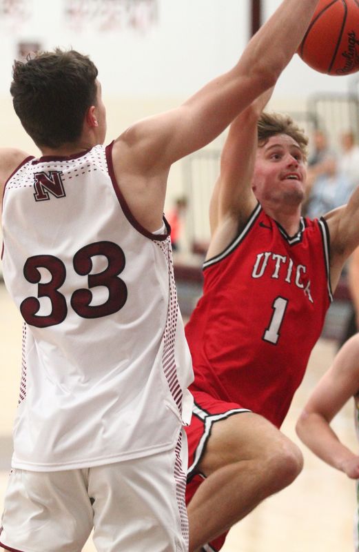 Utica's Hunter McKinney drives against Newark's Jake Quackenbush during the District 11 All-Star game at Jimmy Allen Gymnasium on April 17, 2026.