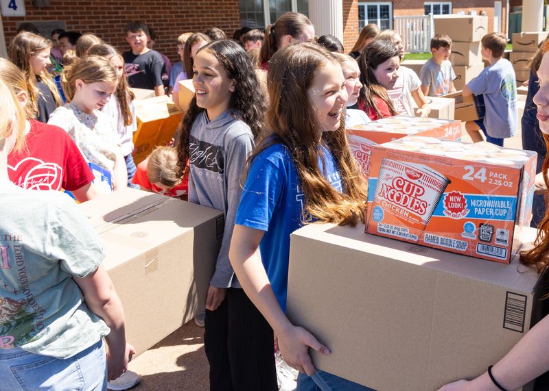 Students at Lake Center Christian School in Hartville helped fill a Stark Area Regional Transit Authority bus with more than 7,000 pounds of food donations for the Akron-Canton Regional Foodbank.