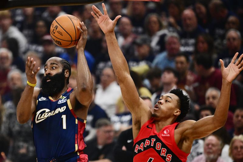 Cavaliers guard James Harden looks to pass as Toronto Raptors forward Scottie Barnes defends in the first quarter of Game 1 of their first-round playoff series, April 18, 2026, in Cleveland.