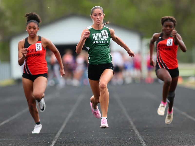 Northridge's Ava Travis leads the 100-meter dash during the Hank Smith Invitational at Heath on April 18, 2026.