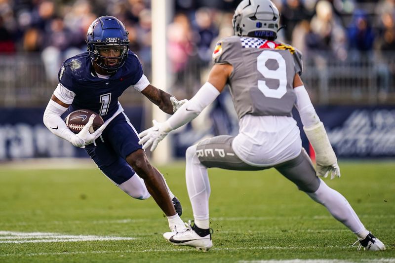 Nov 15, 2025; East Hartford, Connecticut, USA; UConn Huskies wide receiver Skyler Bell (1) runs the ball against the Air Force Falcons in the second half at Pratt & Whitney Stadium at Rentschler Field. Mandatory Credit: David Butler II-Imagn Images