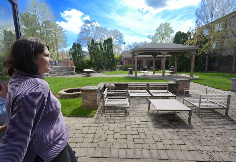 Angelica George of Tangier Catering looks out over the patio area as she talks about the plans for the restaurant/bar and banquet rooms at the Holiday Inn Express in Fairlawn, Ohio on April 17, 2026.