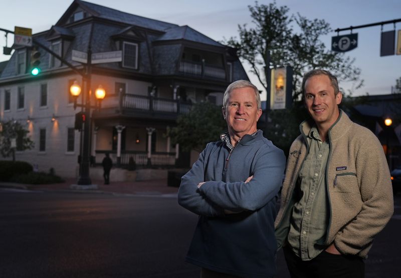 Wolf's Ridge founders Alan Szuter and his son, Bob Szuter, in front of the Worthington Inn
