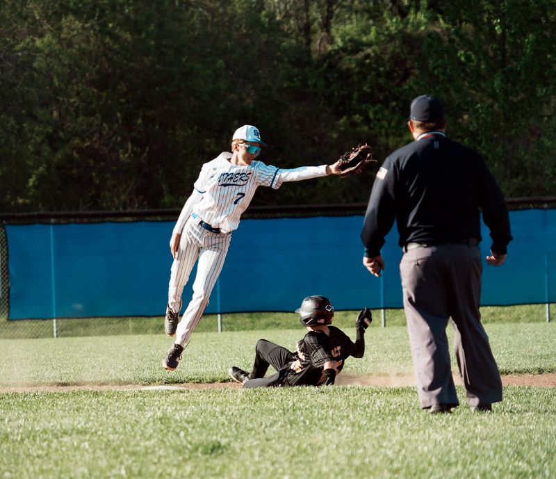 Southeastern's Brycen Kessler catches the ball as a Paint Valley player slides into second base in a 5-4 win over the Bearcats on April 20, 2026, at Southeastern HIgh School.