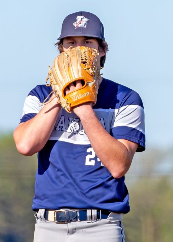Lakota's Jack Widman looks in for the pitch call. Lakota topped SJCC 9-2 on April 20, 2026.