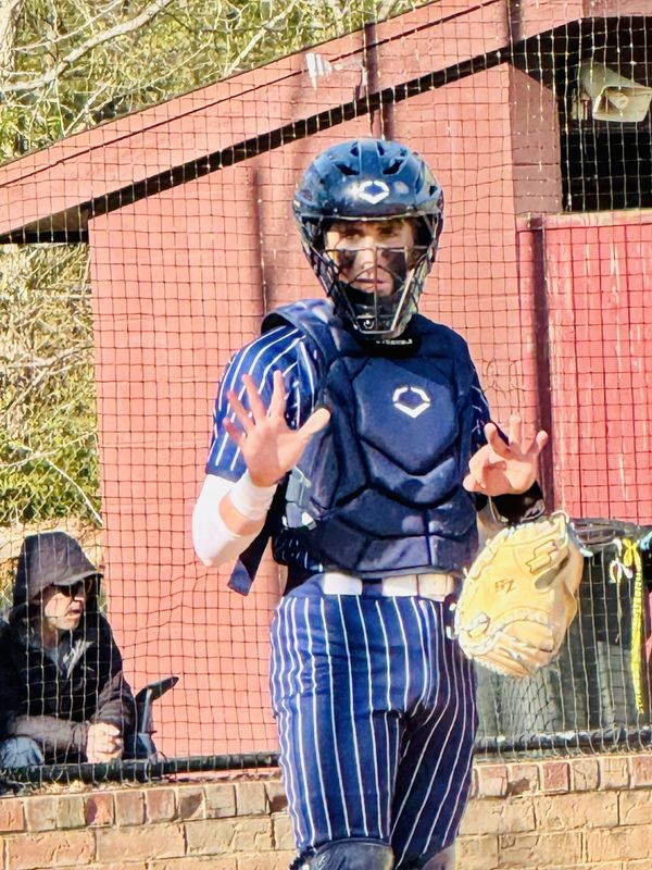 Lancaster senior catcher Brayden Montgomery looks to the bench for a sign during the Gales' 7-4 win over Canal Winchester April 20, 2026.