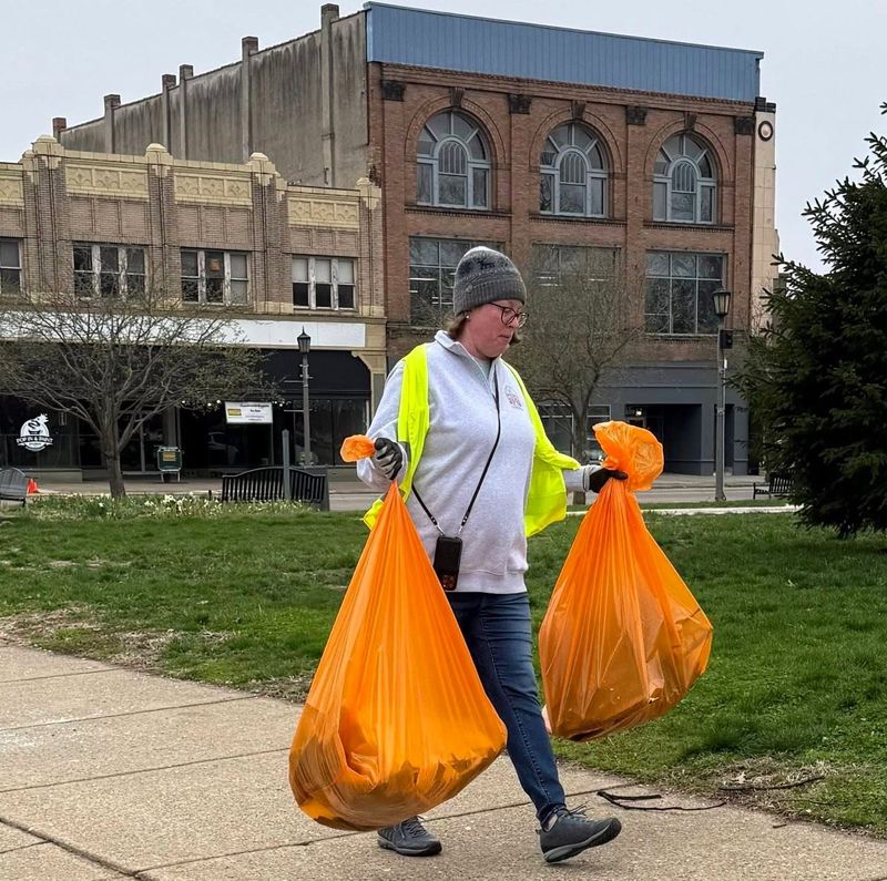 Megan Daugherty carries bags of trash collected along Main Street during one of Our Town Coshocton's One Block at a Time initiatives. Once a month volunteers help beautify a part of Downtown Coshocton. The next one is scheduled for 9 a.m. to noon May 16. Individuals will meet at the gazebo on the Coshocton Court Square.
