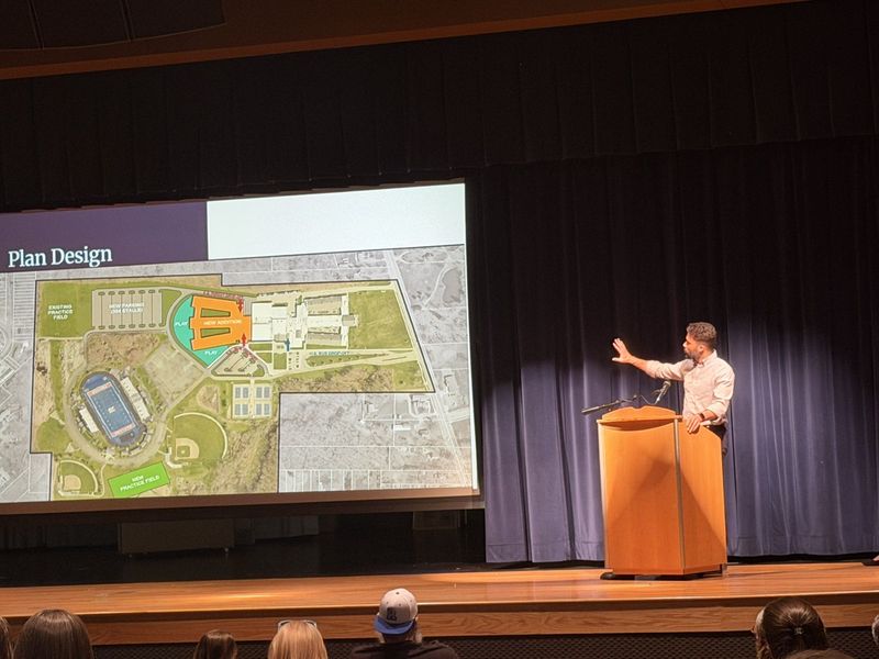 Architect Jonathan Imler shows a plan for new construction at the site of Ravenna High School. The plan would build an elementary school to the end of the existing high school, housing all students from kindergarten through grade 12 on one campus.