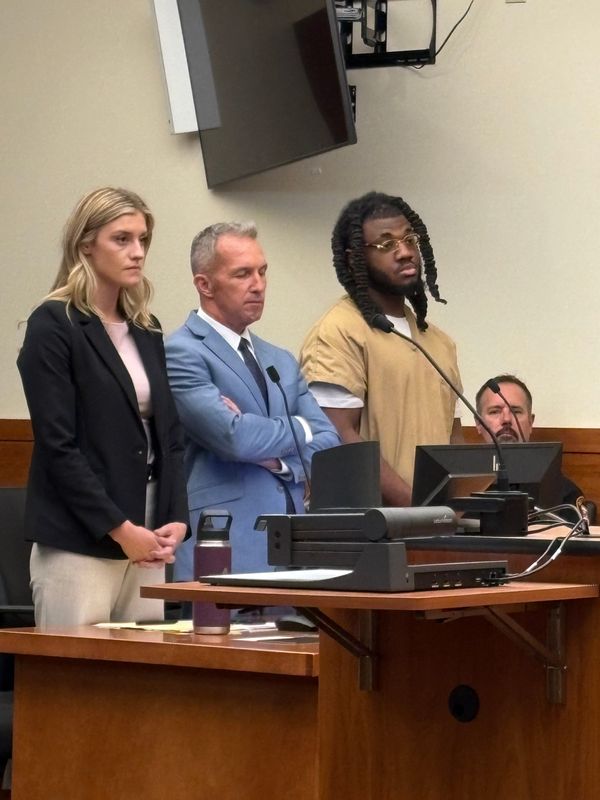 Tyrez Turner, right, stands with his attorneys Alexis Dodge and Jeremy Dodgion as Franklin County Common Pleas Court Judge Jeff Brown sentences Turner to life in prison with no possibility of parole for at least 29 years.