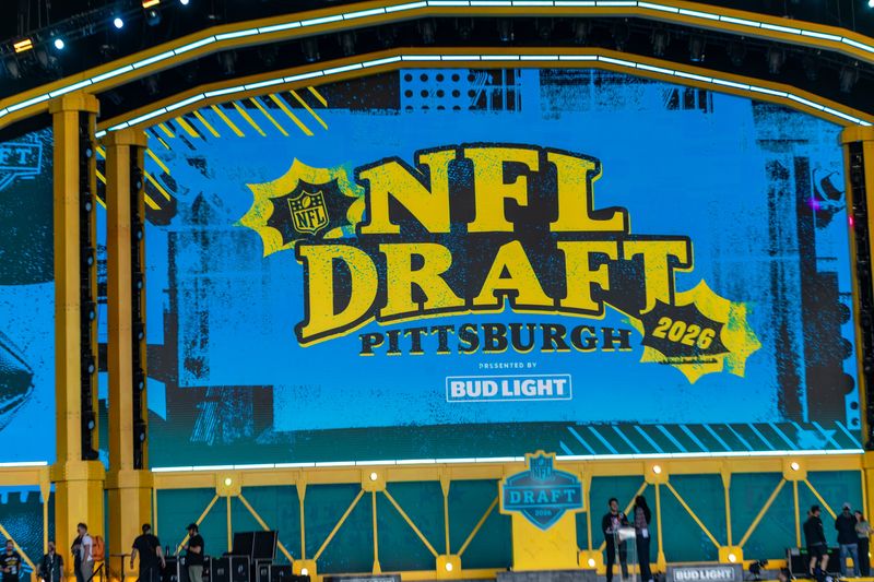 The logo of the 2026 NFL Draft is showcased at the big screen inside the theater Wednesday, April 22, 2026 from outside Acrisure Stadium in Pittsburgh, Pa.