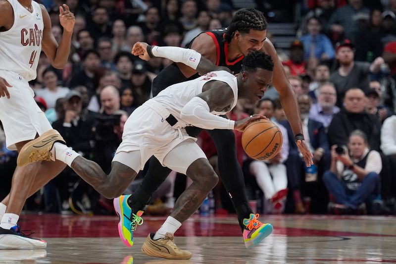 Apr 23, 2026; Toronto, Ontario, CAN; Cleveland Cavaliersguard Dennis Schroder (8) steals a ball from Toronto Raptors forward Collin Murray-Boyles (12) during the first half of game three of the first round of the 2026 NBA Playoffs at Scotiabank Arena. Mandatory Credit: John E. Sokolowski-Imagn Images