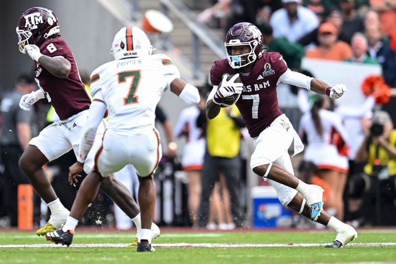 Dec 20, 2025; College Station, TX, USA; Texas A&M Aggies wide receiver KC Concepcion (7) runs the ball against the Miami Hurricanes during the second half at Kyle Field. Mandatory Credit: Maria Lysaker-Imagn Images
