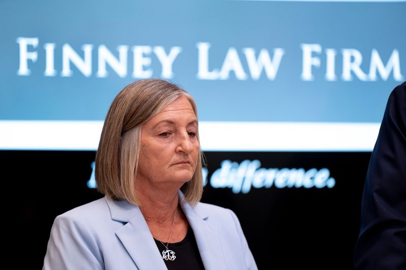 Police Chief Teresa Theetge stands with Cincinnati Employment Attorney Stephen Imm at the Finney Law Firm in Cincinnati on Friday, April 24, 2026.