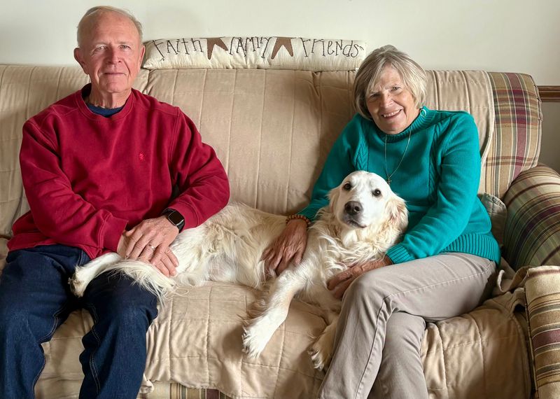 Ken and Martha Hyland are shown with their golden retriever, Zeb. A Marlboro Township dog trainer was convicted of negligently causing Zeb's death last year during a training session.