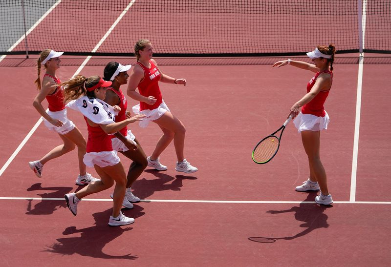 Members of the Ohio State Buckeyes women's tennis team run to congratulate Irina Cantos Siemers after she defeated Rutgers Scarlet Knights Tess Fisher in the No. 1 singles match to clinch the Big Ten Conference title in Columbus on April 24, 2022.

Ncaa Tennis Rutgers Scarlet Knights At Ohio State Buckeyes