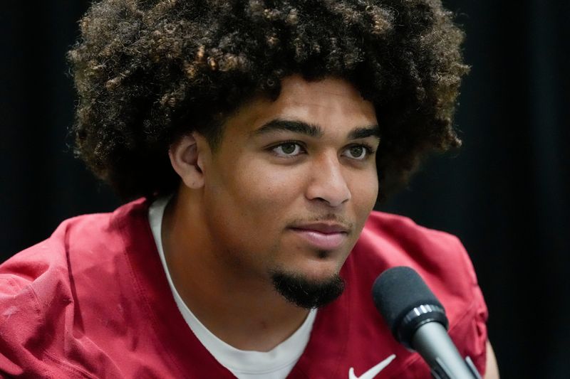 Aug. 4, 2025; Tuscaloosa, AL, USA; Alabama Crimson Tide players and coaches participate in a media day with reporters and fans at the Hank Crisp Indoor Practice Facility. Center Parker Brailsford answers questions from the media.