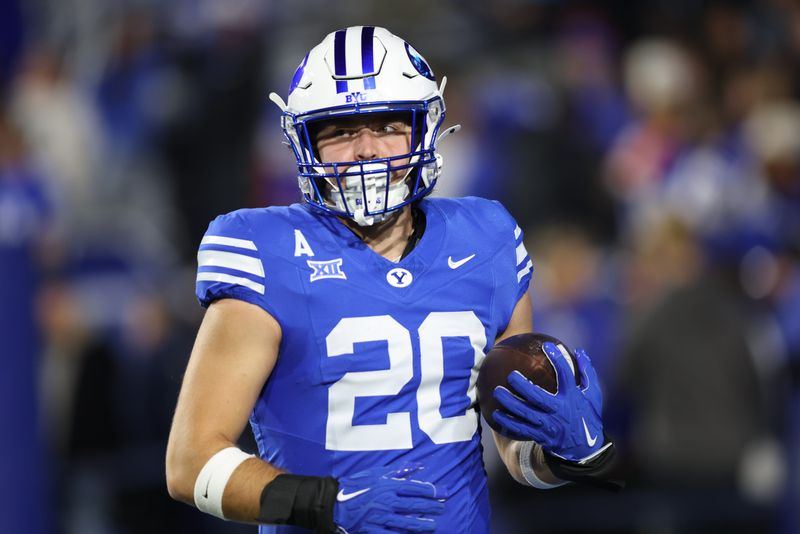 Nov 15, 2025; Provo, Utah, USA; BYU Cougars tight end Carsen Ryan (20) warms up before the game against the Texas Christian University Horned Frogs at LaVell Edwards Stadium. Mandatory Credit: Rob Gray-Imagn Images