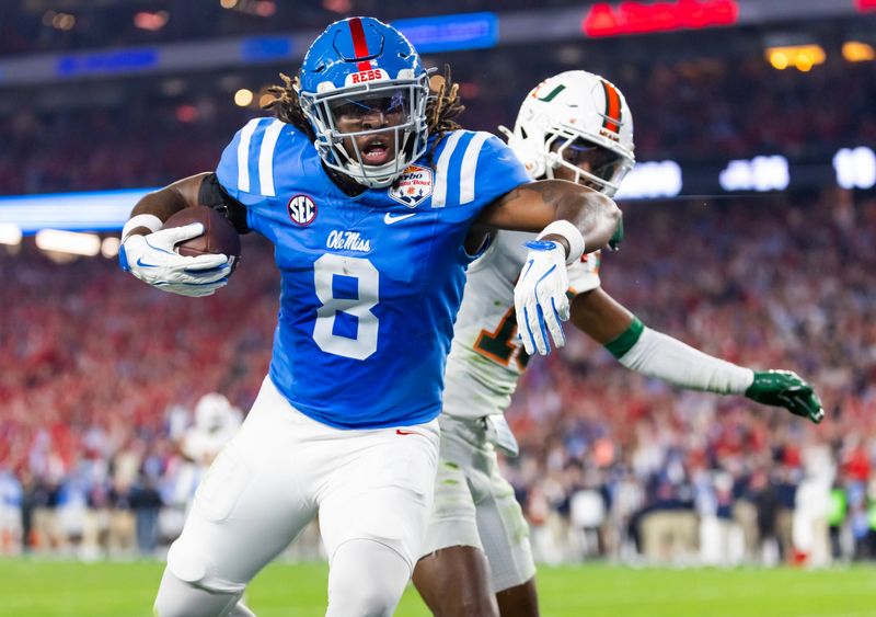 Mississippi Rebels tight end Dae'Quan Wright (8) scores a touchdown against the Miami Hurricanes during the 2026 Fiesta Bowl and semifinal game of the College Football Playoff at State Farm Stadium.