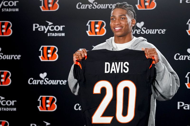 Cincinnati Bengals third round pick Tacario Davis holds his jersey at a press conference during the 2026 NFL Draft, Saturday, April 25, 2026, at Paycor Stadium in downtown Cincinnati.