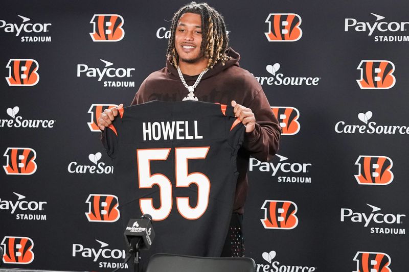 Cincinnati Bengals third round pick Tacario Davis holds his jersey at a press conference during the 2026 NFL Draft, Saturday, April 25, 2026, at Paycor Stadium in downtown Cincinnati.