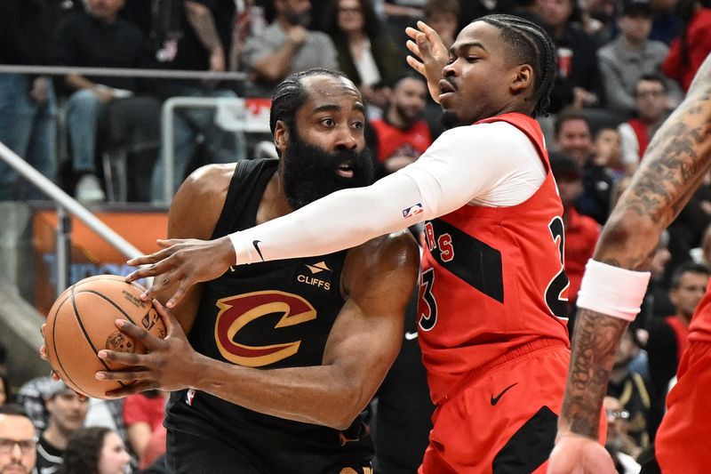 Cleveland Cavaliers guard James Harden (1) looks for a passing option while being closely guarded by Toronto Raptors guard Jamal Shead (23) during Game 4 of an 2026 NBA Playoffs first-round series April 26, 2026, in Toronto, Ontario.