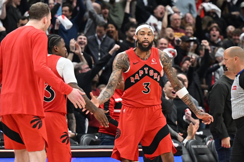 Apr 26, 2026; Toronto, Ontario, CAN; Toronto Raptors forward Brandon Ingram (3) is greeted by team mates after sinking a three point basket at the end of the first half against the Cleveland Cavaliers during game four of the first round of the 2026 NBA Playoffs at Scotiabank Arena. Mandatory Credit: Dan Hamilton-Imagn Images