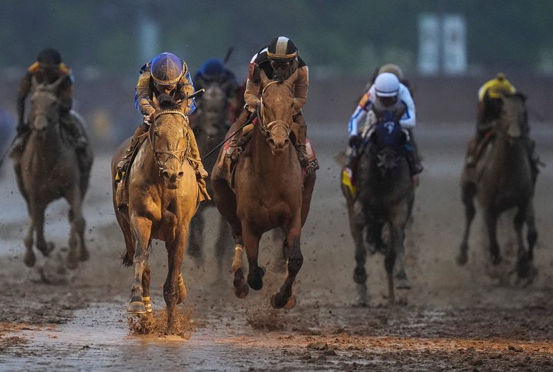 Jockey Junior Alvarado and Sovereignty were bathed in the finish line light as they won the 2025 Kentucky Derby Saturday, May 3, 2025 at Churchill Downs in Louisville, Kentucky.