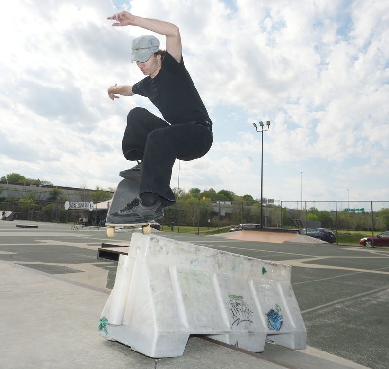 Gabe Vigliotti of Youngstown nosegrinds a parking barrier at Canton’s 9th Street D.I.Y. skatepark.