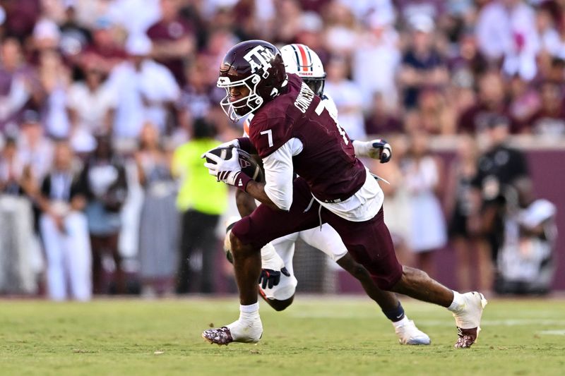 Sep 27, 2025; College Station, Texas, USA; Texas A&M Aggies wide receiver KC Concepcion (7) runs the ball against the Auburn Tigers during the second half at Kyle Field. Mandatory Credit: Maria Lysaker-Imagn Images