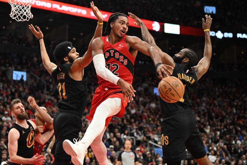 Apr 26, 2026; Toronto, Ontario, CAN; Toronto Raptors forward Collin Murray-Boyles (12) passes the ball away from Cleveland Cavaliers center Jarrett Allen (31) and guard James Harden (1) during game four of the first round of the 2026 NBA Playoffs at Scotiabank Arena. Mandatory Credit: Dan Hamilton-Imagn Images