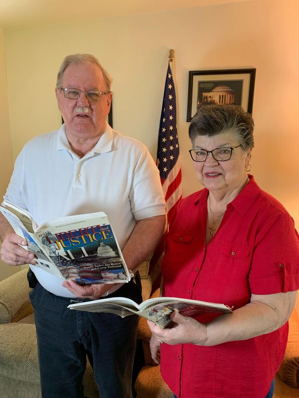 Gary Kobs and Janet Borton, co-chairs of the Wayne County Christian Community Choir and Orchestra, look over the choral score of "With Liberty and Justice For All," to be performed Monday, June 29, at the Wayne County Fair Event Center. They are looking for people who sang the music 28 years ago as well as new members to join the group.