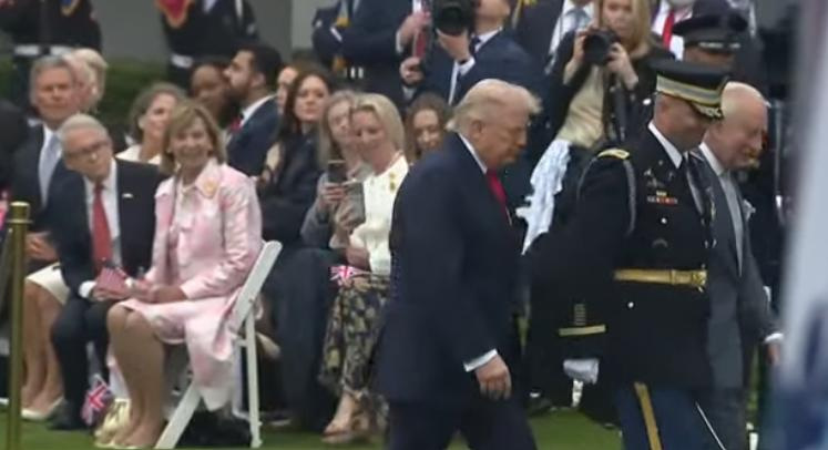 Ohio Gov. Mike DeWine, right, and first lady Fran DeWine are seated in front row of the South Lawn of the White House during the 21-gun salute April 28, 2026, in Washington.