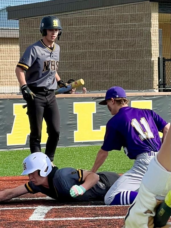 Northmor's Trevor Brubaker slides to score a run during a home baseball game with East Knox. The Golden Knights are sitting second in the Knox Morrow Athletic Conference standings with Mount Gilead and Fredericktown.