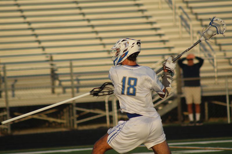 Wooster's Drew Thomas launches a shot.