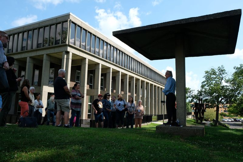 Alan Canfora gives a tour of the May 4 site to visitors Aug. 1, 2019. Canfora, one of the students wounded on May 4, 1970, died in December 2020.