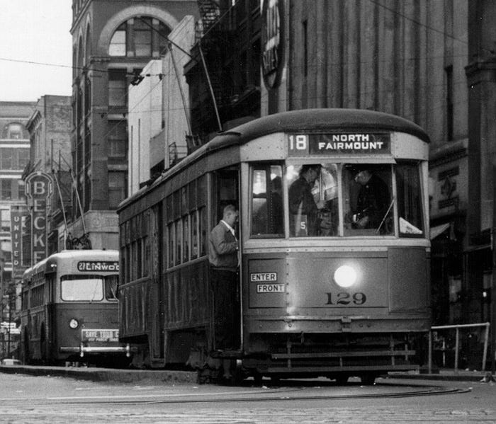 This streetcar photo was taken April 25, 1951, at 5:55 a.m. at Fifth and Vine. In the background is a trolley bus that was taking the place of streetcars.