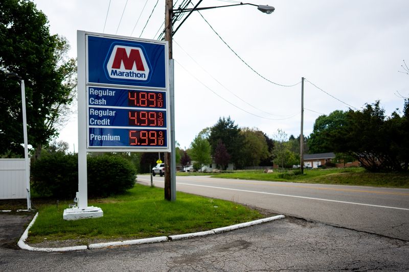 The price of gas is listed at a Marathon station on Copley Rd fills his gas tank, April 30, 2026, in Akron, Ohio.